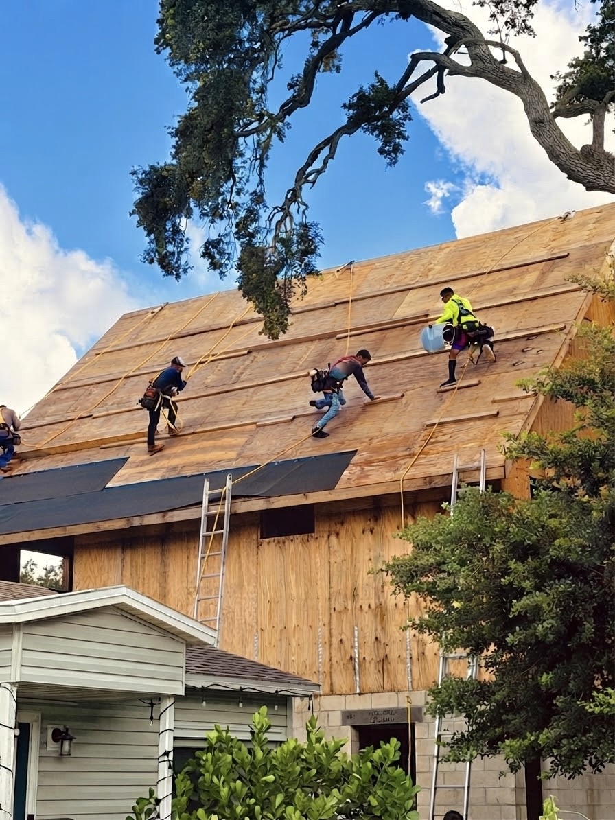Matlock Custom Homes roofers installing roof decking on a custom home